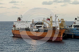 Oil tanker unloading at sea