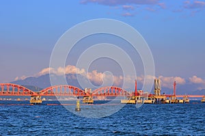 Oil transfer pipe line on sea under sunset light