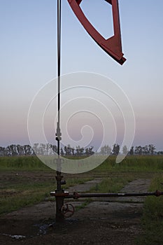 Oil valves and piping. production wellhead. A natural oil well. Horizontal view of a wellhead with valve armature. Oil and gas