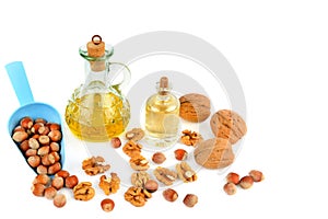 Oil of walnut and hazelnut, nuts isolated on white background.