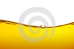 Oil wave background, yellow liquid, on white background. close-up view