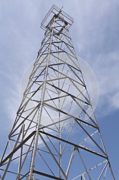 Oil Well Derrick With Clouds