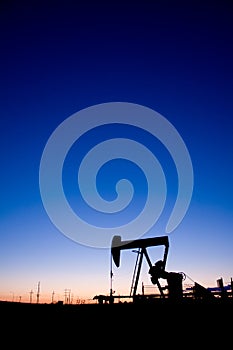 Oil well pumpjack sunset