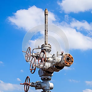 Oil well after repair in mud and puddles