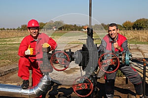 Oil Well and Two Oil Workers