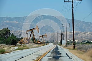 Oil Wells by Road on the Horizon. AI Generative