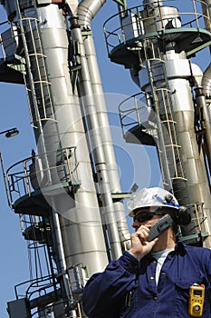 Oil worker and oil towers