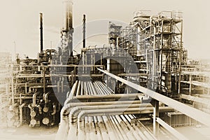 Oil worker with pipelines constructions photo