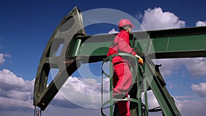 Oil Worker and Pump Jack Drilling Rig