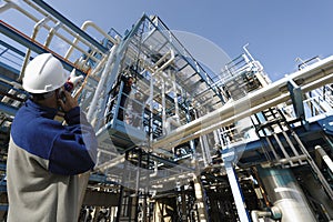 Oil worker and refinery photo