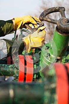 Oil worker turning valve