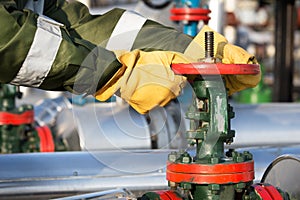 Oil worker turning valve photo