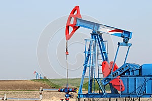 Oilfield with pump jack photo