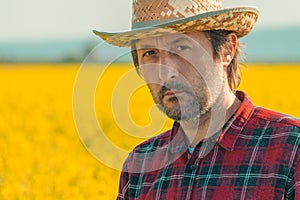 Oilseed rape farmer posing in field