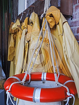 Oilskins in a rescue station vertical