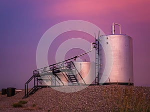 Oilwell at sunset with an purple and pink sky Landscape photo