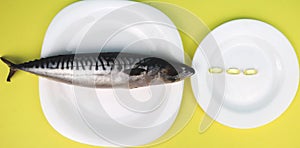 Oily fish mackerel and or food supplement omega-3 in capsules.