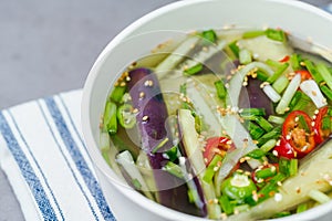 Oinaengguk, Korean Chilled Cucumber Soup, prepared with julienned, seasoned cucumber in a cool broth made with soy sauce, garlic