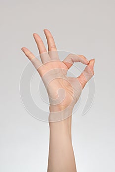 Ok hand gesture isolated on white background