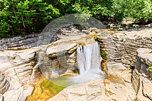 Okatse first canyon and small Kinchkha waterfall in the canyon of the river Okatse. Rest in Georgia. Rocky ledges of the