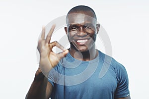 Okay sign, exercise and portrait of black man on a white background for training, workout and fitness. Sports, emoji and