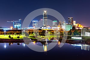 Oklahoma City Skyline at Dusk with Buildings Reflected in Water photo