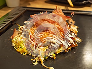 Okonomiyaki on an iron pan in Japan