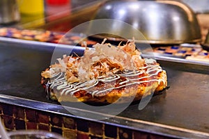 Okonomiyaki , Japanese fried pizza, The popular Japanese food, selected focus.