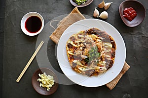 okonomiyaki, Traditional Japanese Pizza, Japanese hot plate pizza from Okonomiyaki. made of flour which is diluted with water or