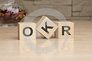 OKR - acronym from wooden blocks with letters, top view on grey background