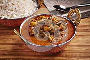 Okra Stew with white rice Khoresht Bamia or lady finger curry served in dish isolated on table side view of middle east food photo