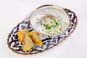 Okroshka - a traditional Russian soup from cucumbers, radishes,