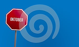 Oktober - red sign with blue sky