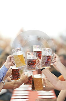 Oktoberfest beer drinkers raise glass