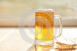 Oktoberfest beer. Glass beer mugs full of golden lager with thick frothy heads conceptual of Oktoberfest. Beer mug. Big glass of