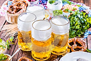 Oktoberfest food menu, bavarian sausages with pretzels, mashed potato, sauerkraut, beer photo
