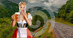 Oktoberfest girl waitress with beer. Woman wearing a traditional Bavarian or german dirndl on octoberfest, serving big