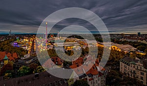 The Oktoberfest / Wiesn in Munich in total view at the evening