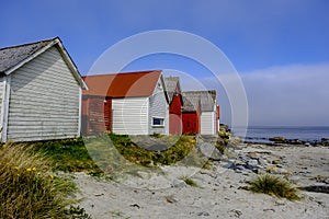 Row Or Line Of Traditional Colourful Beach Huts