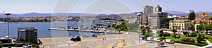 Olbia, Sardinia / Italy - 2019/07/21: Panoramic view of Olbia port and yacht marina shore area with Citi hall - Municipio di Olbia