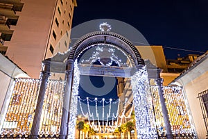 Old 1840s Decorated gate at Christmas time in Follonica, Italy