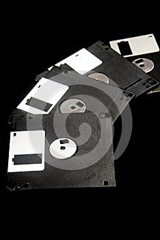 old 3.5-inch floppy disks on black