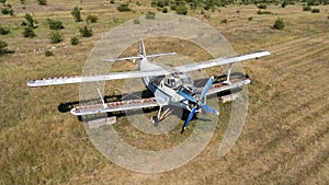 Old abandoned airplane on the field. Top view