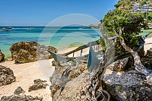 Old abandoned boat on the white sandy beach of Boracay Philippines.