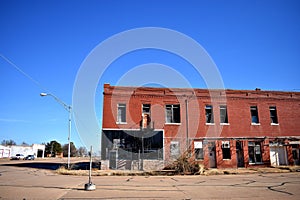 Old Abandoned Brick Building on a Small Town Main Street