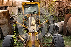 Old abandoned broken road construction machinery
