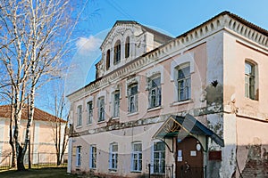 Old abandoned building of the 18th century. Facade of an ancient house