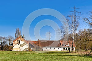 Old abandoned building of farm called `Alter Gutshof Am stillen Meiler`. A former farm located next to closed down power plant photo
