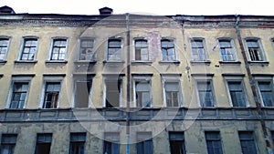 An old abandoned building and traces of fire - soot on the walls near the windows
