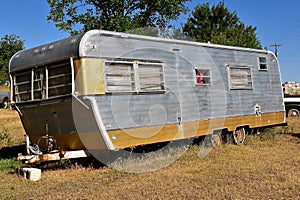 An old abandoned camper or mobile home